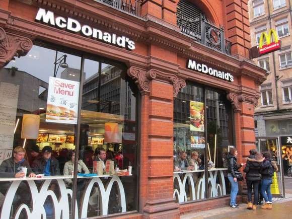 A McDonald's restaurant on a street corner
