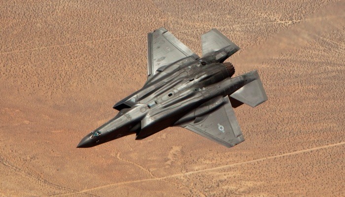 F-35 fighter flying upside down.