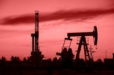 Land Drilling Oil and Gas Two Rigs in the Sunset