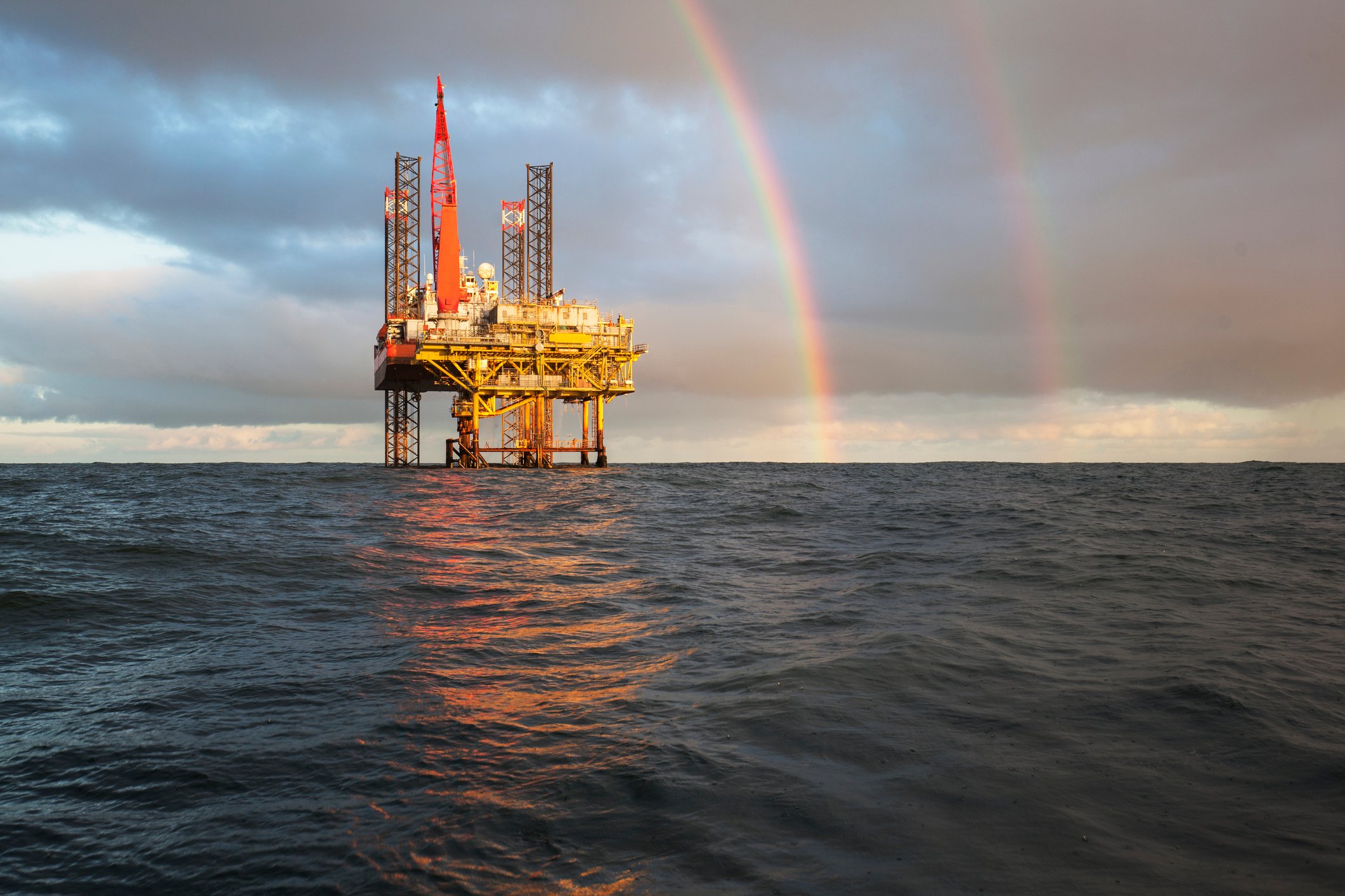 Offshore jackup rig with rainbow.