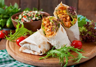 Chipotle Burrito Mexican Food on a Wood Platter