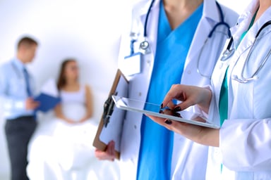 Physicians looking at tablet