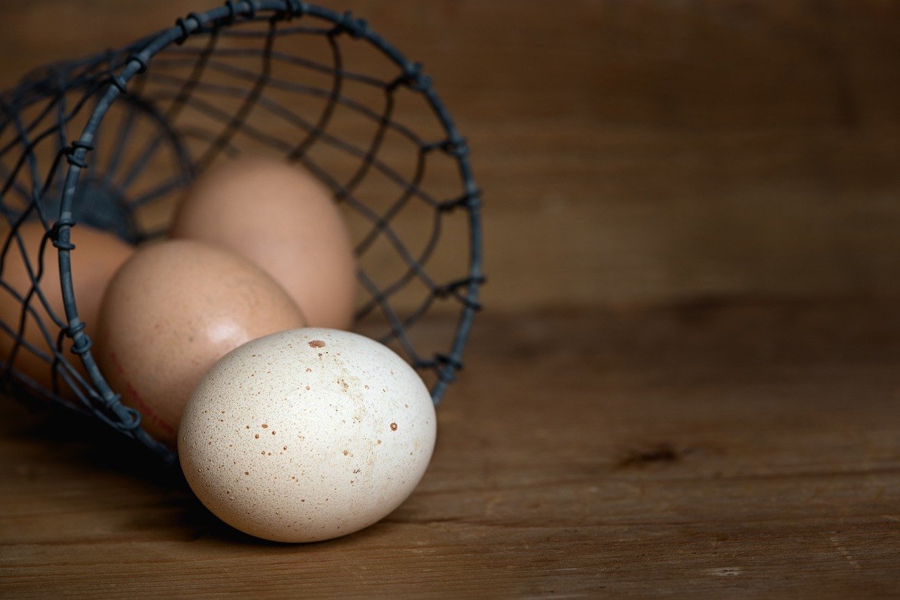 A basket with eggs rolling out.