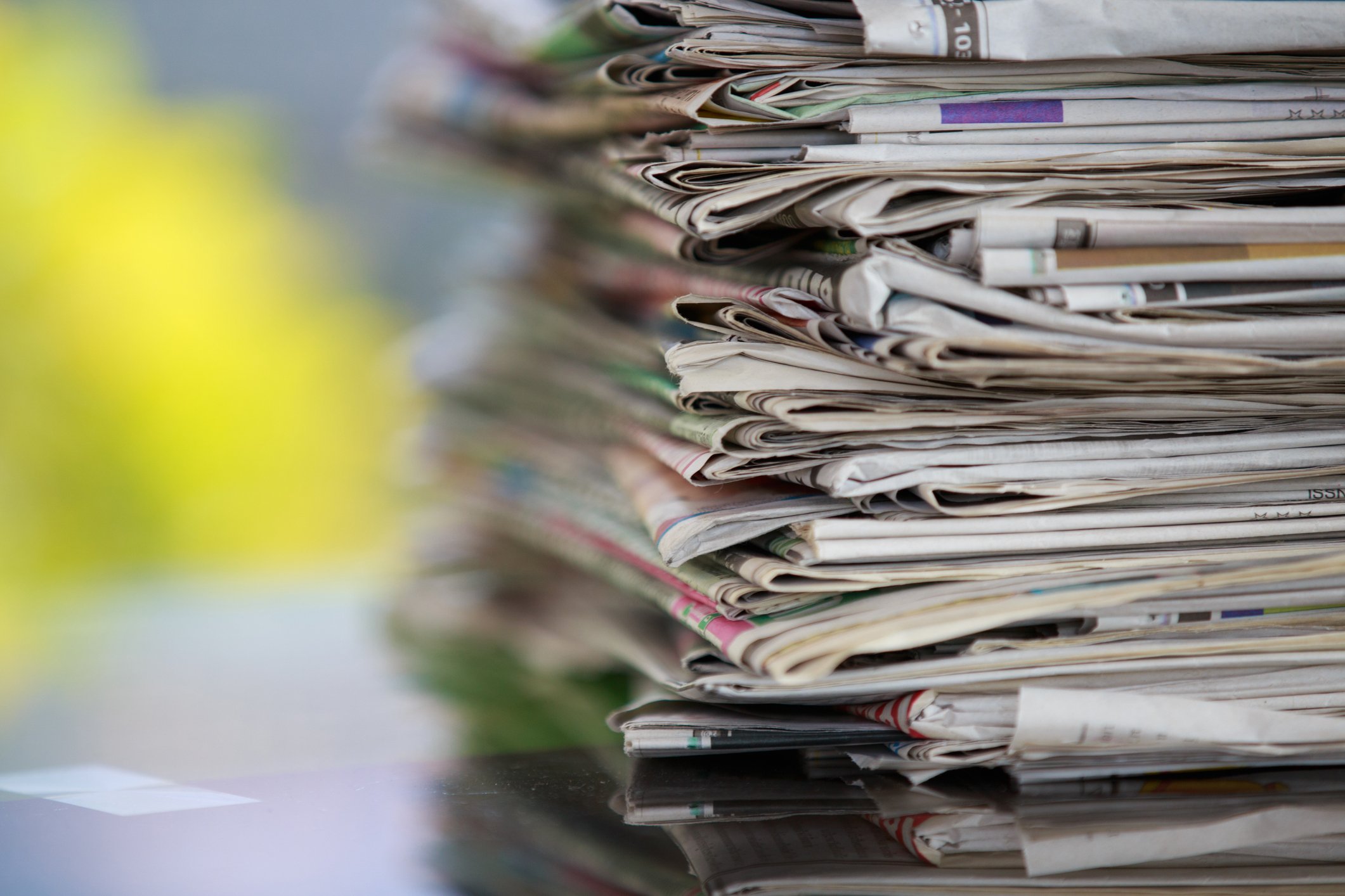Stack of newspapers and magazines.