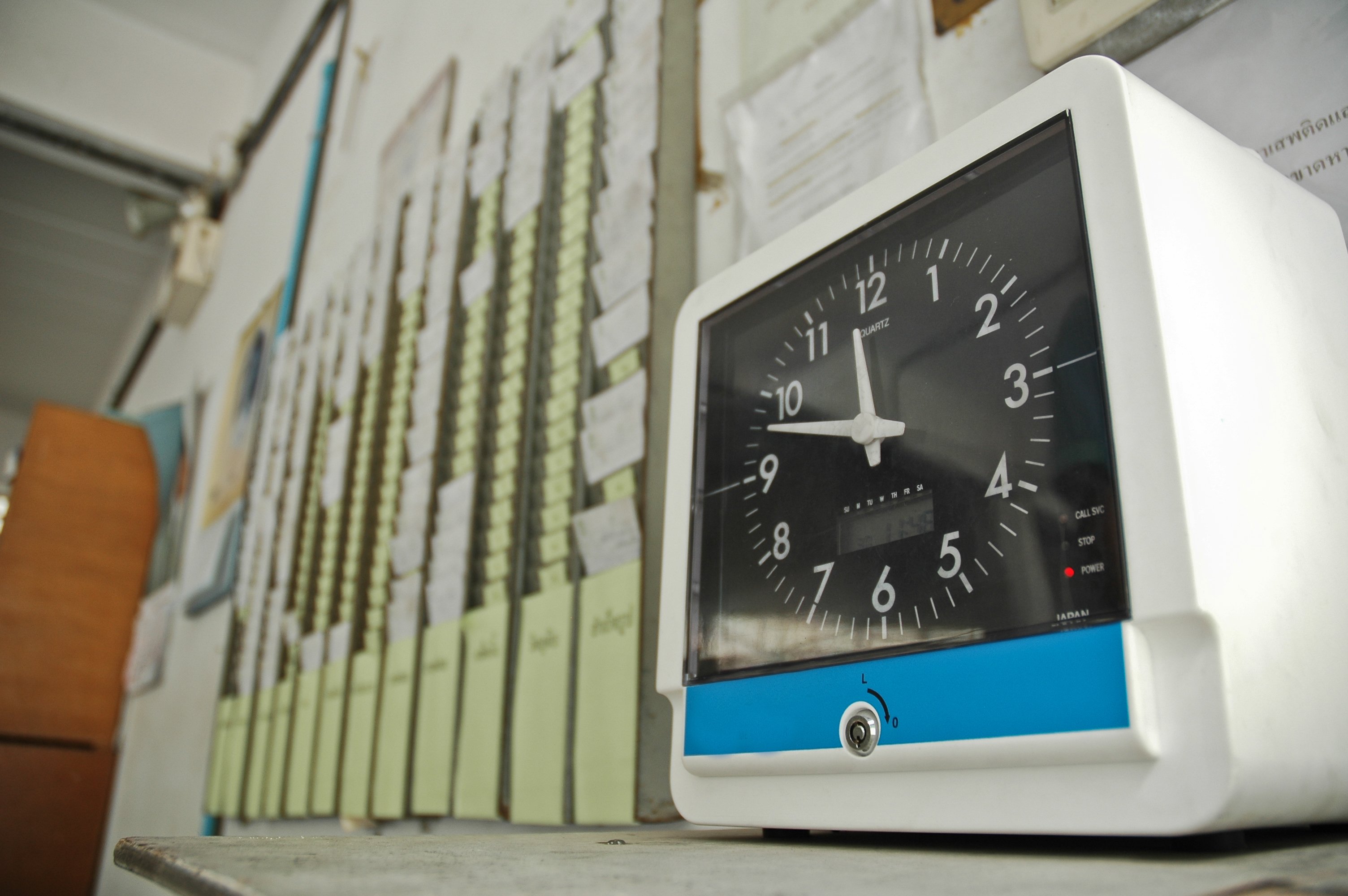 A time clock where workers punch in.