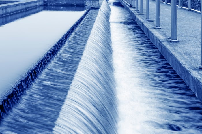 Water flowing over a dam in a treatment plant.