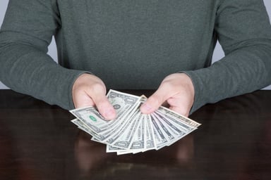 person counting money_GettyImages-672973584