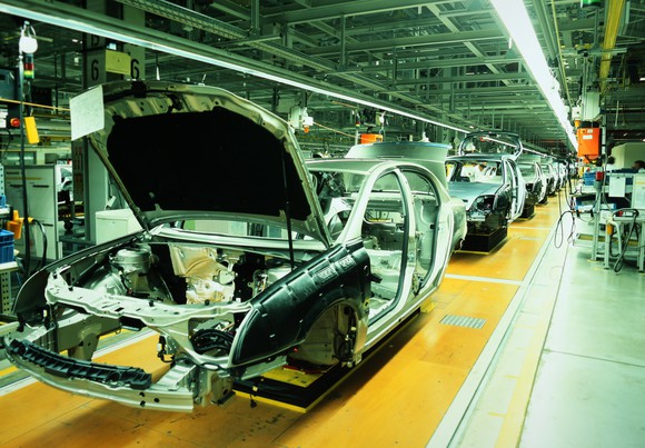 Cars in production on an assembly line