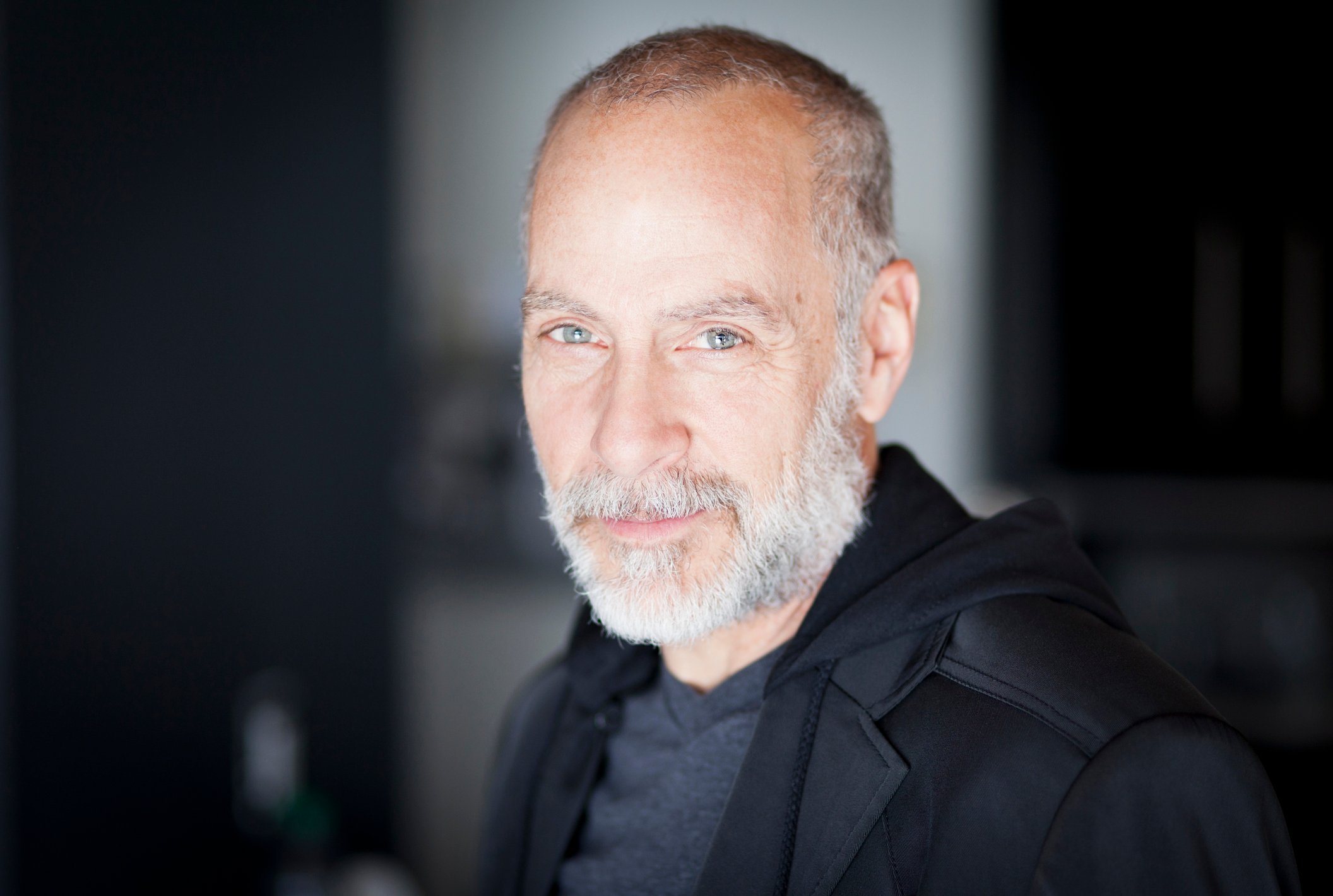 Older man with a serious smile