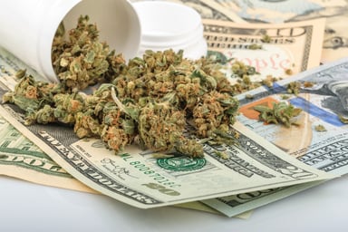 Marijuana buds on money