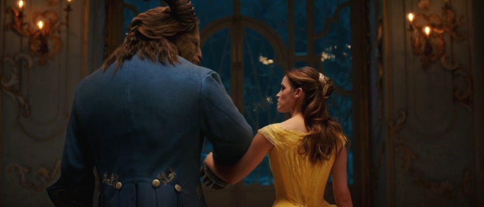 Scene from "Beauty and the Beast" -- two title characters walking arm-in-arm, as shown from behind.