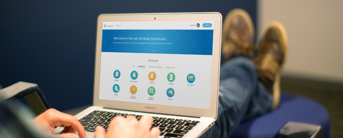 A man accesses Workday's website on a laptop.