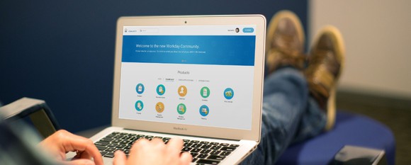 A man accesses Workday's website on a laptop.