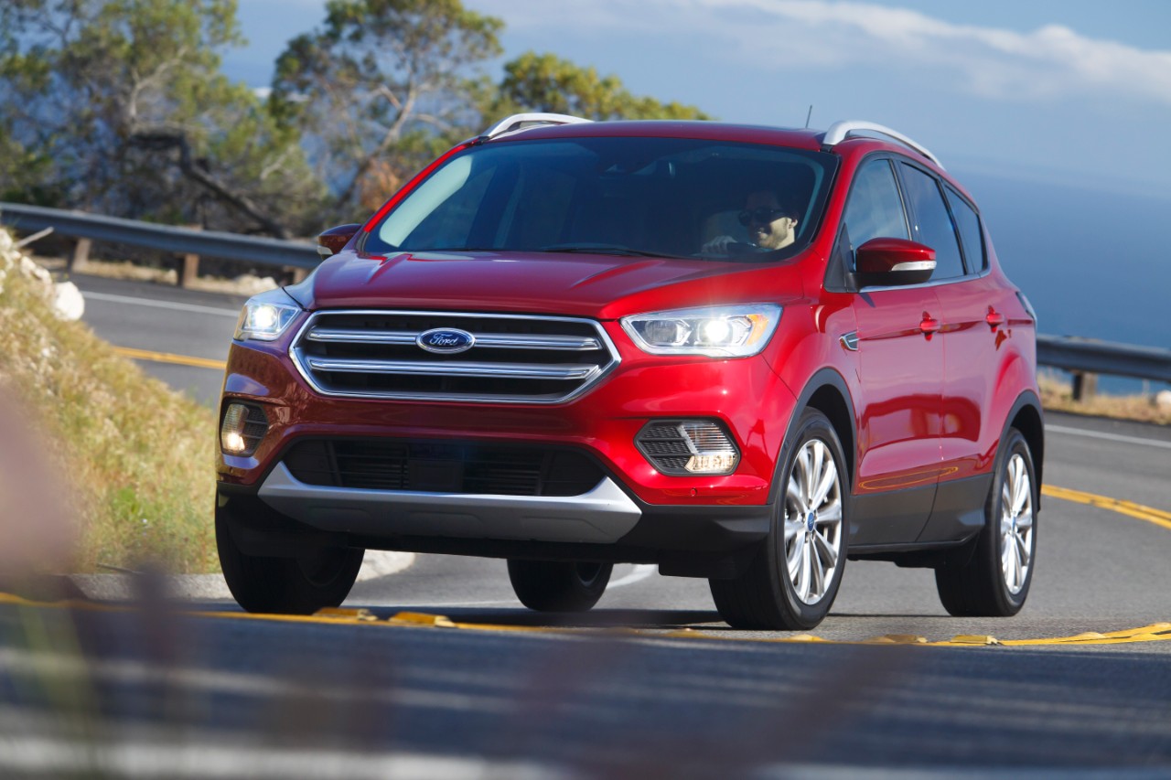 Front view of Ford's 2017 Escape as it climbs a winding road.