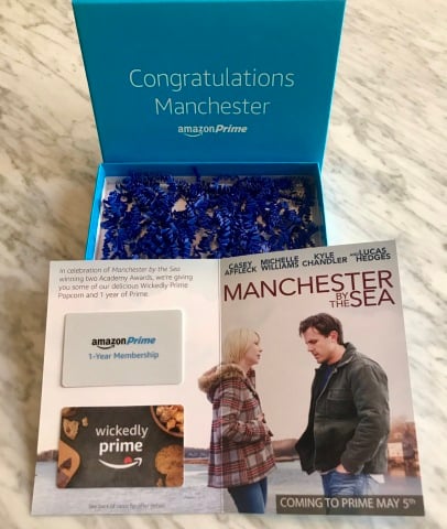 Gift box containing two gift cards on card showing movie image.