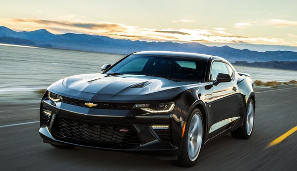 A Camaro coupe on a seaside road.