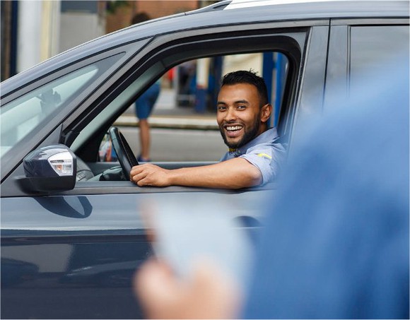 An Uber driver picks up a passenger.