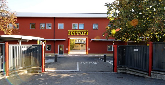 A pre-war factory building with a gateway to the Ferrari corporate campus. 