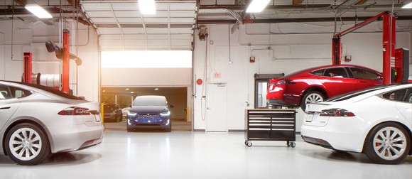 Tesla vehicles inside a service center