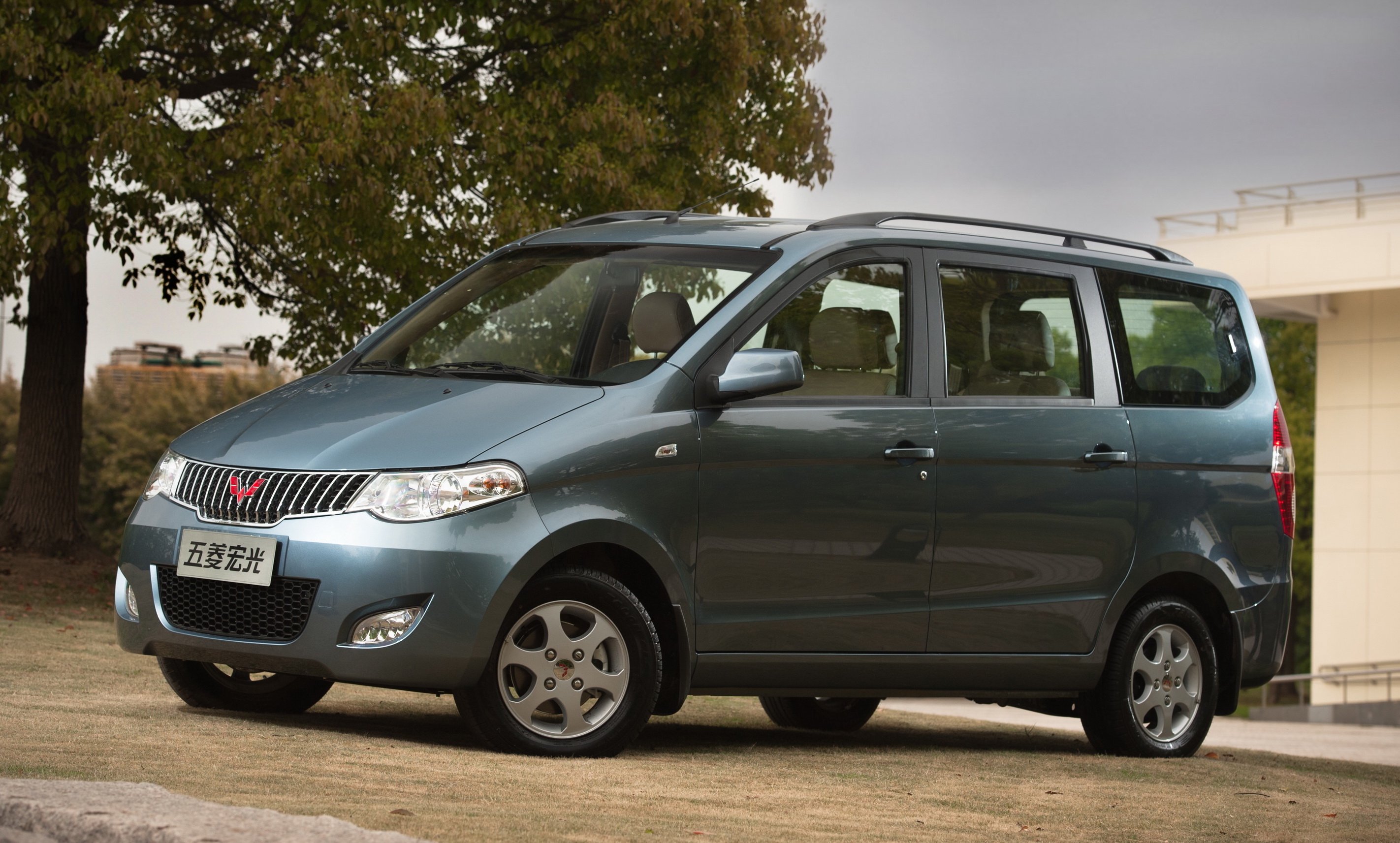 The Hong Guang S, a very small blue minivan.