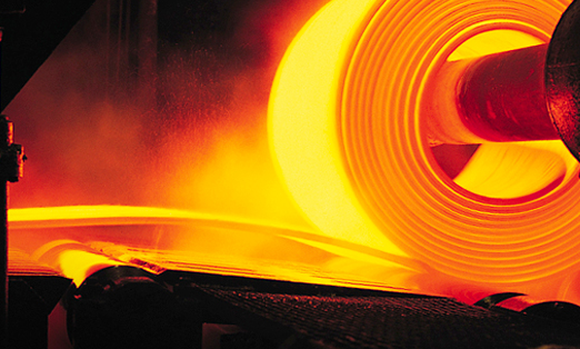 A hot roll of metal in a Nucor steel mill.