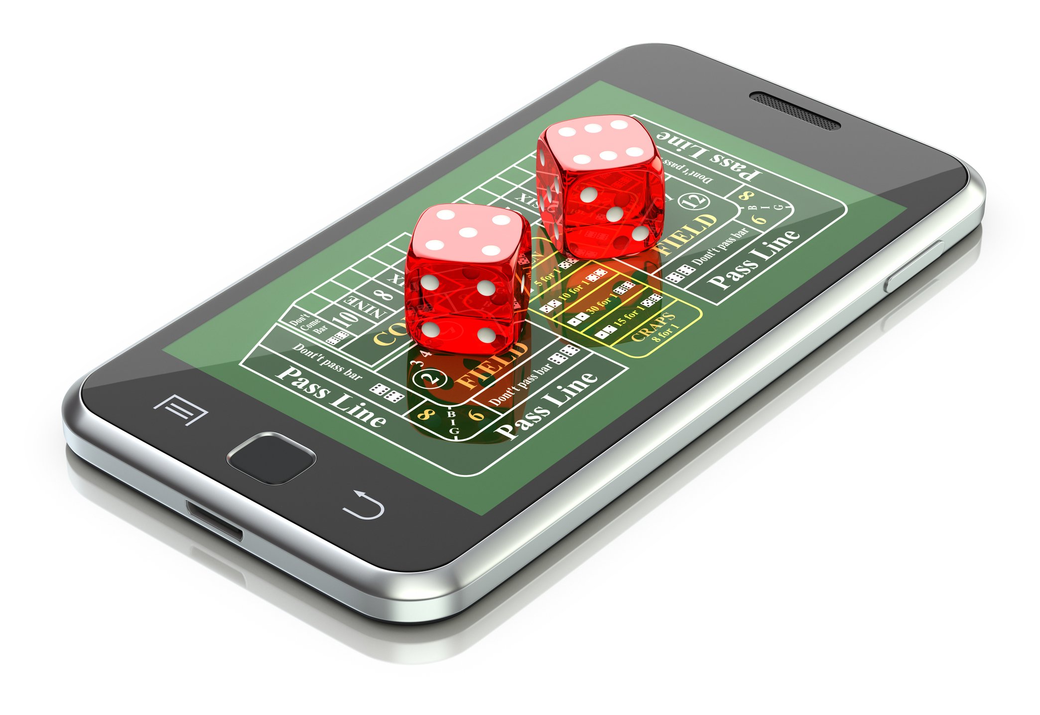 Dice on top of a smartphone showing a gambling app.