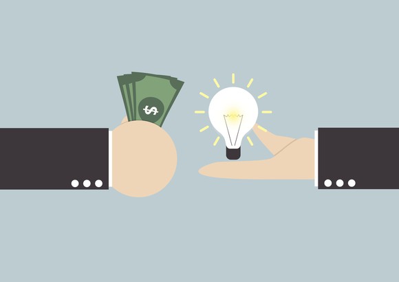 Illustration of a light bulb being exchanged for a fistfull of cash.