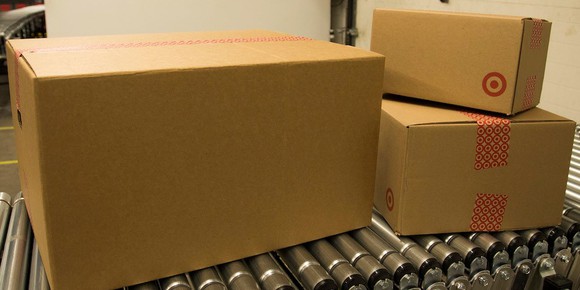 Boxes roll on a conveyor belt at a Target shipping facility.