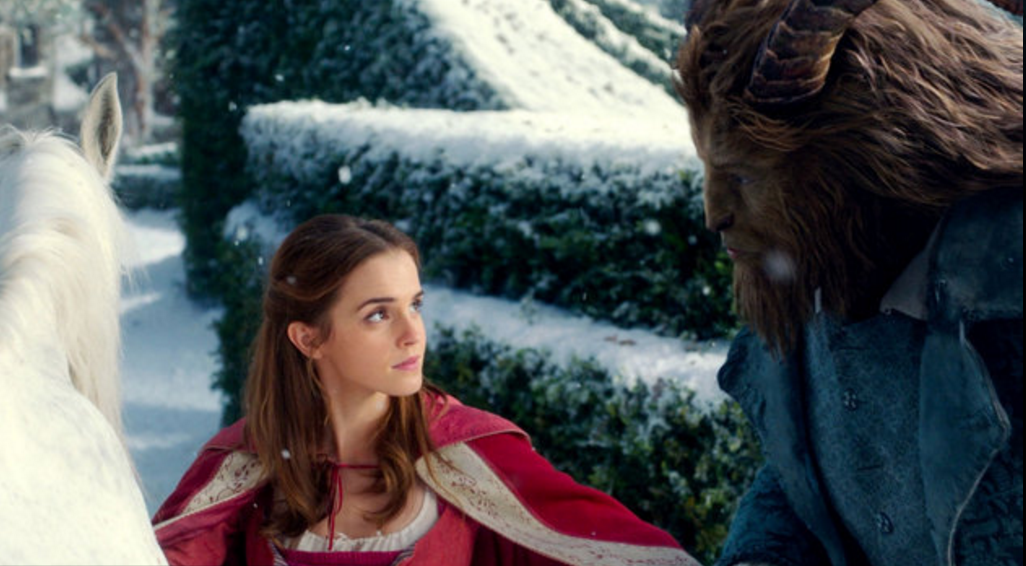 Scene from "Beauty and the Beast" showing two title characters looking at each other while outside.