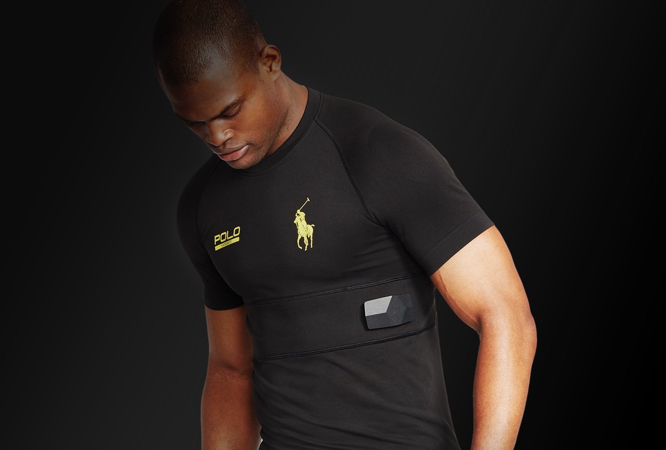 A man wearing a shirt with an embedded sensor.