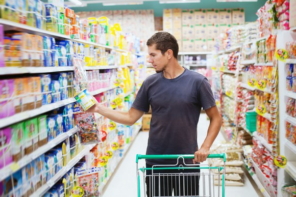 A man shopping in a grocery store. 
