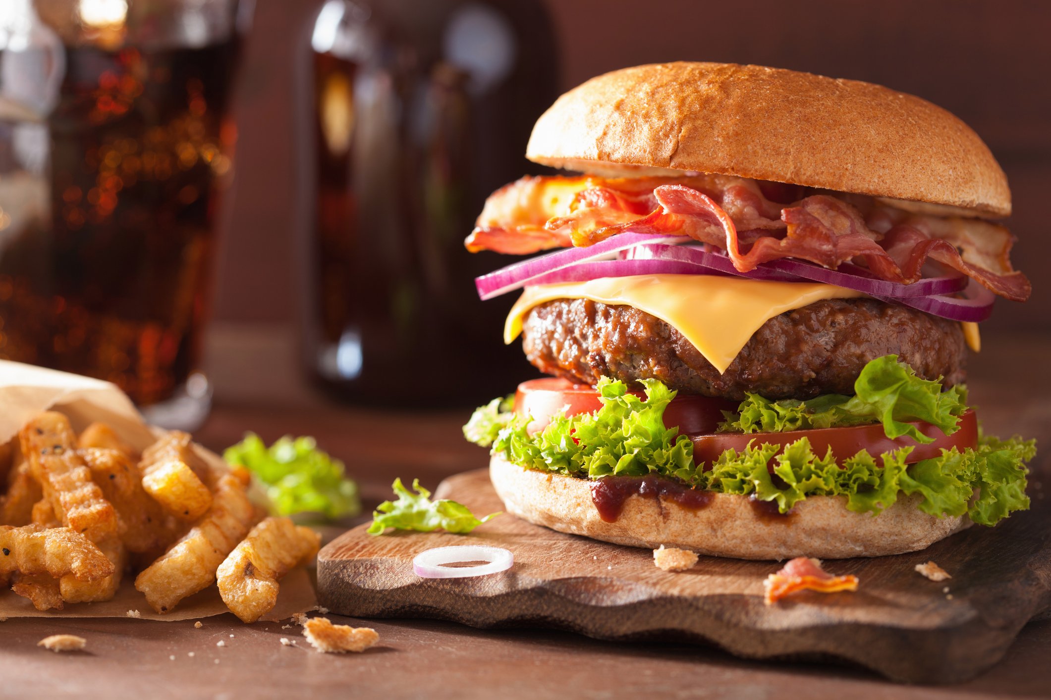 Picture of a burger with fries.