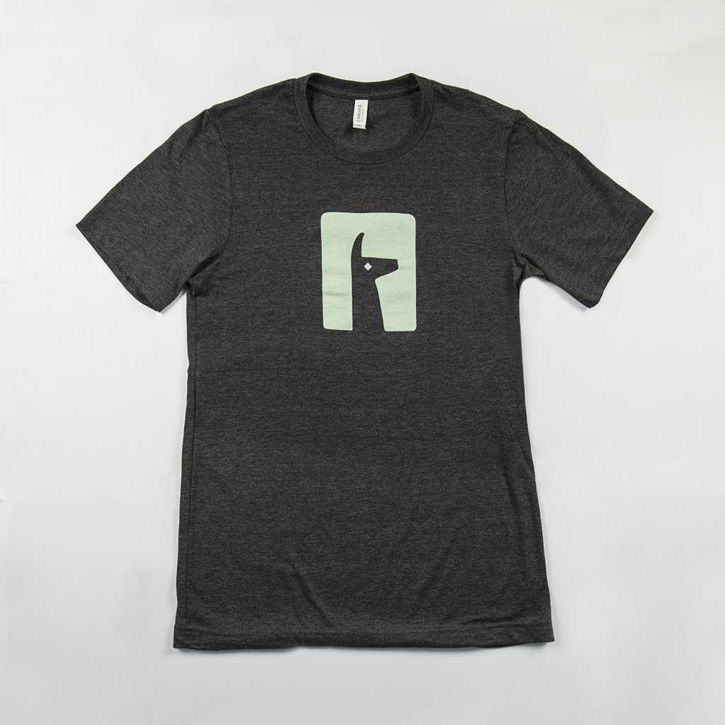 A black t-shirt with a silhouette of a Llama related to Alto's Adventure. 
