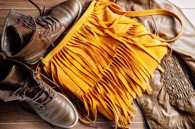 Women's Apparel and Accessories Arranged on Table