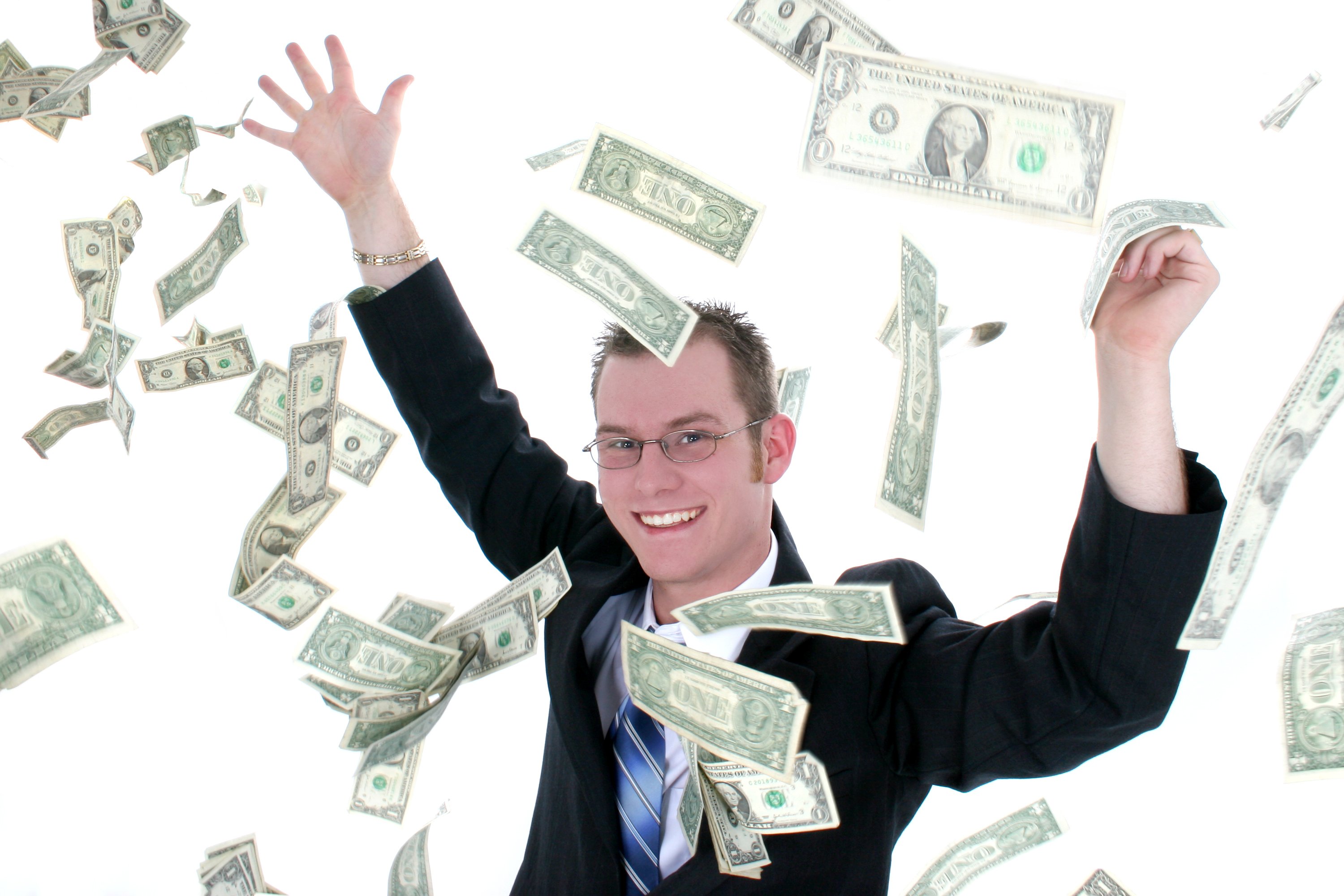 Man in suit throwing money in the air