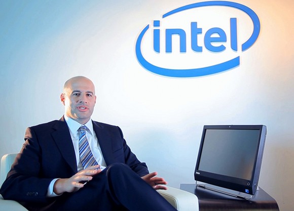 Intel's Gregory Bryant sitting next to a computer.
