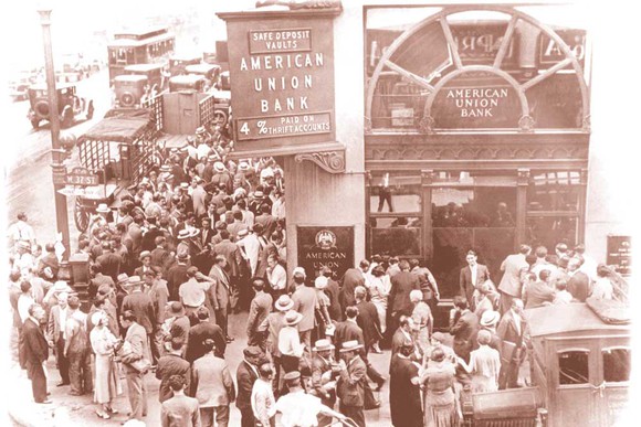 People line up outside a bank for a bank run.