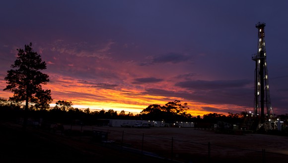 Land rig drilling at sunset.