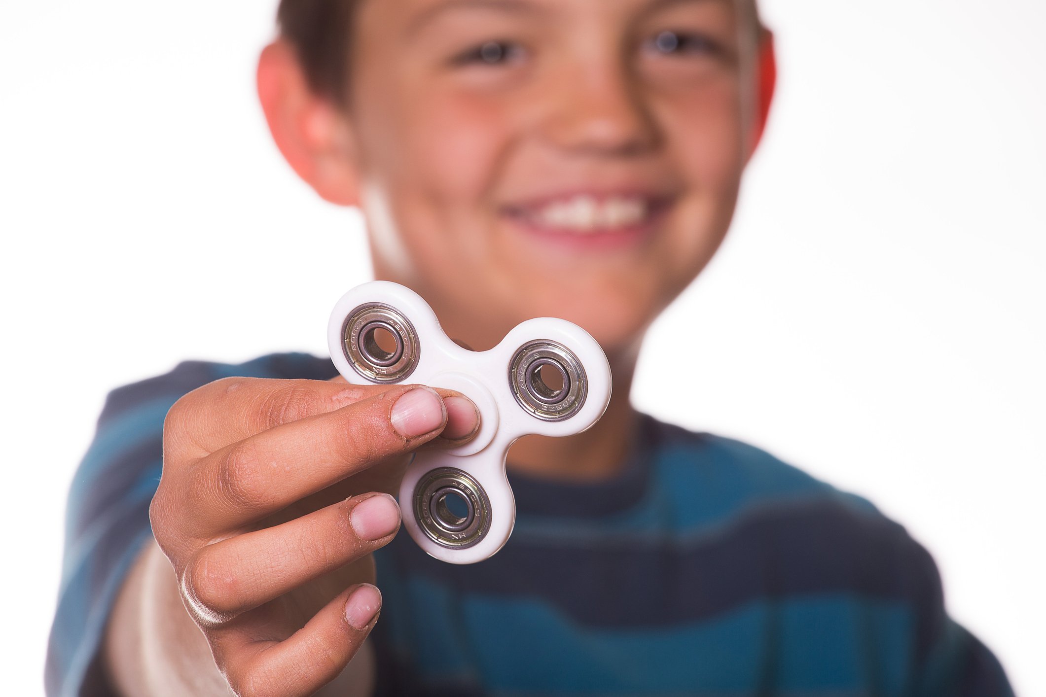 Boy holding a fidget spinner