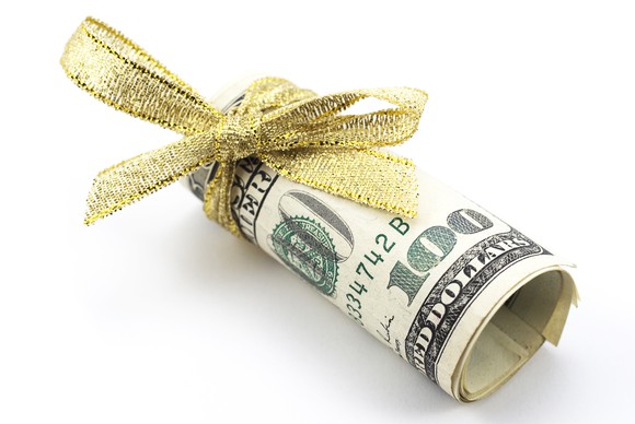 A roll of cash wrapped in a bow.