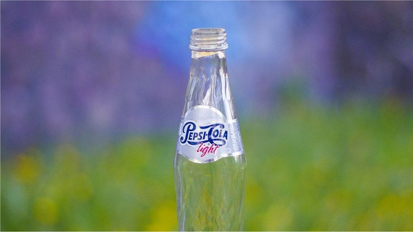 An empty bottle of Pepsi.