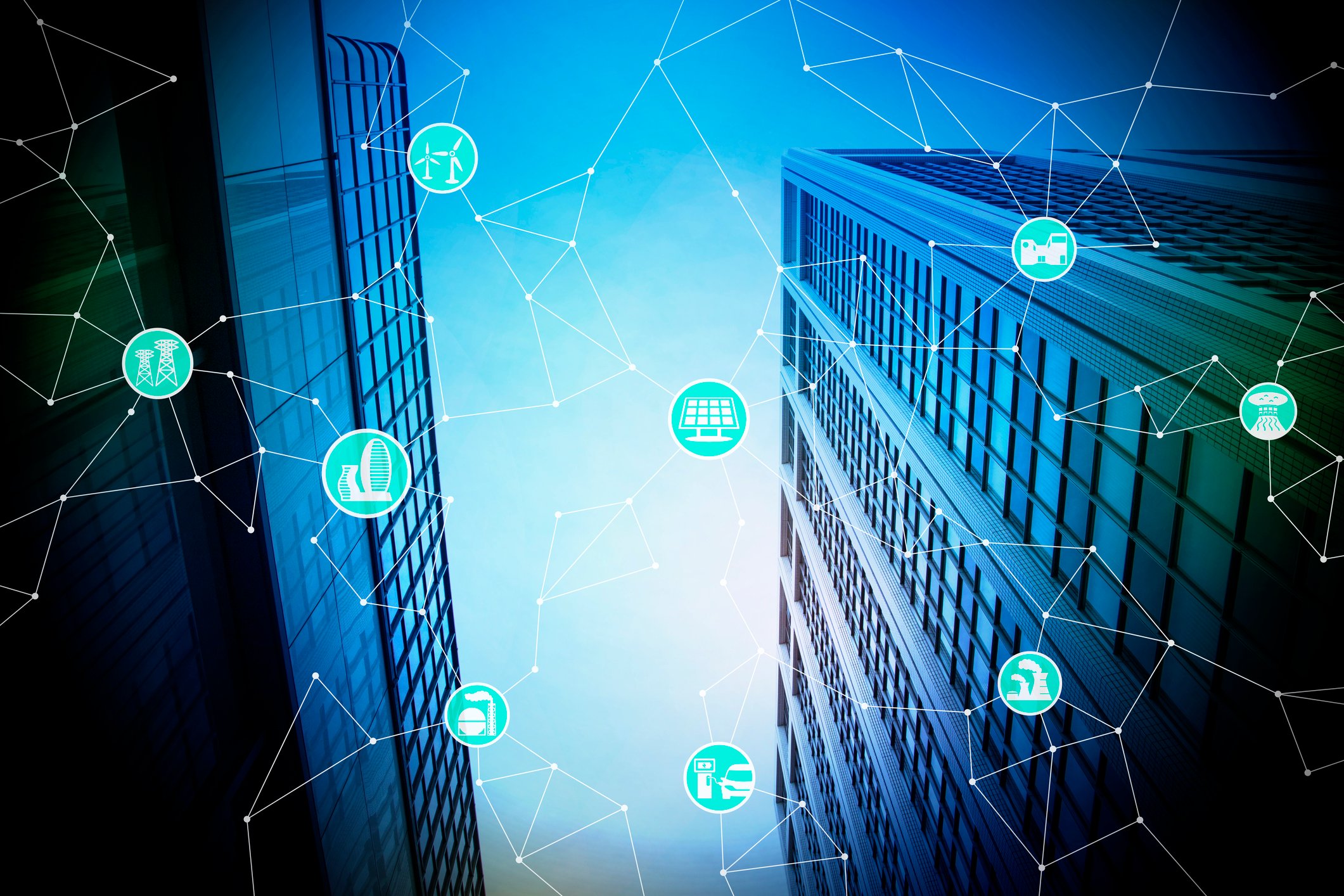 Image of a city with a graphic of connected devices overlaid on top of it.