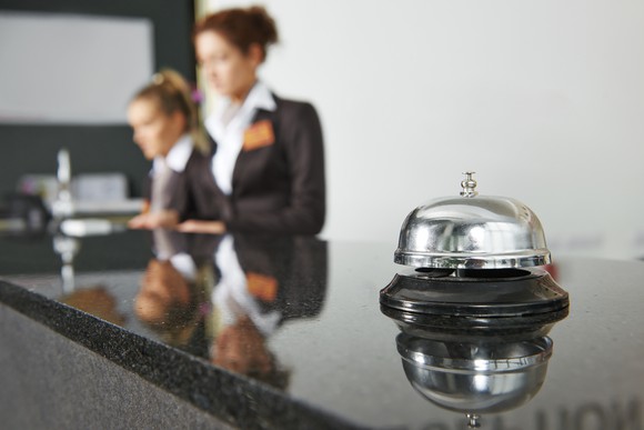 Hotel reception desk with service bell.