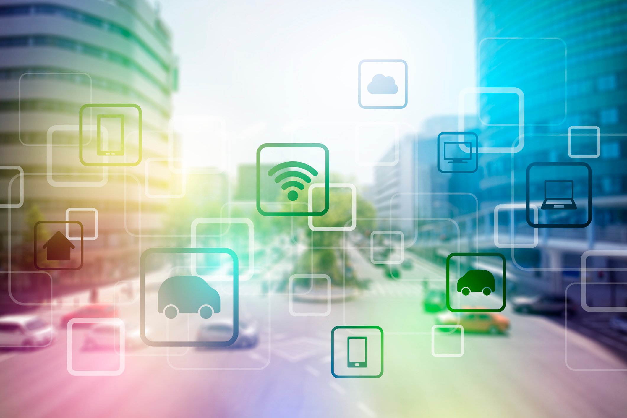 City street with icons overlaid representing Internet of Things connectivity.