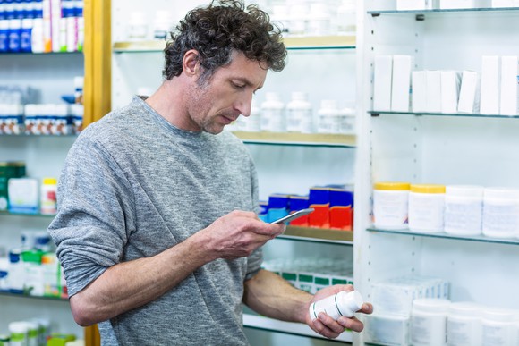 Consumer shopping at a pharmacy store.
