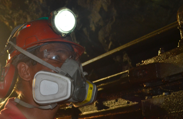 A First Majestic Silver employee in a mask.