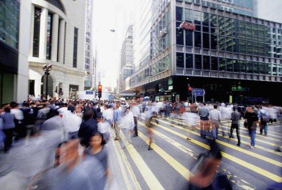 A busy intersection full of pedestrians in Hong Kong. 