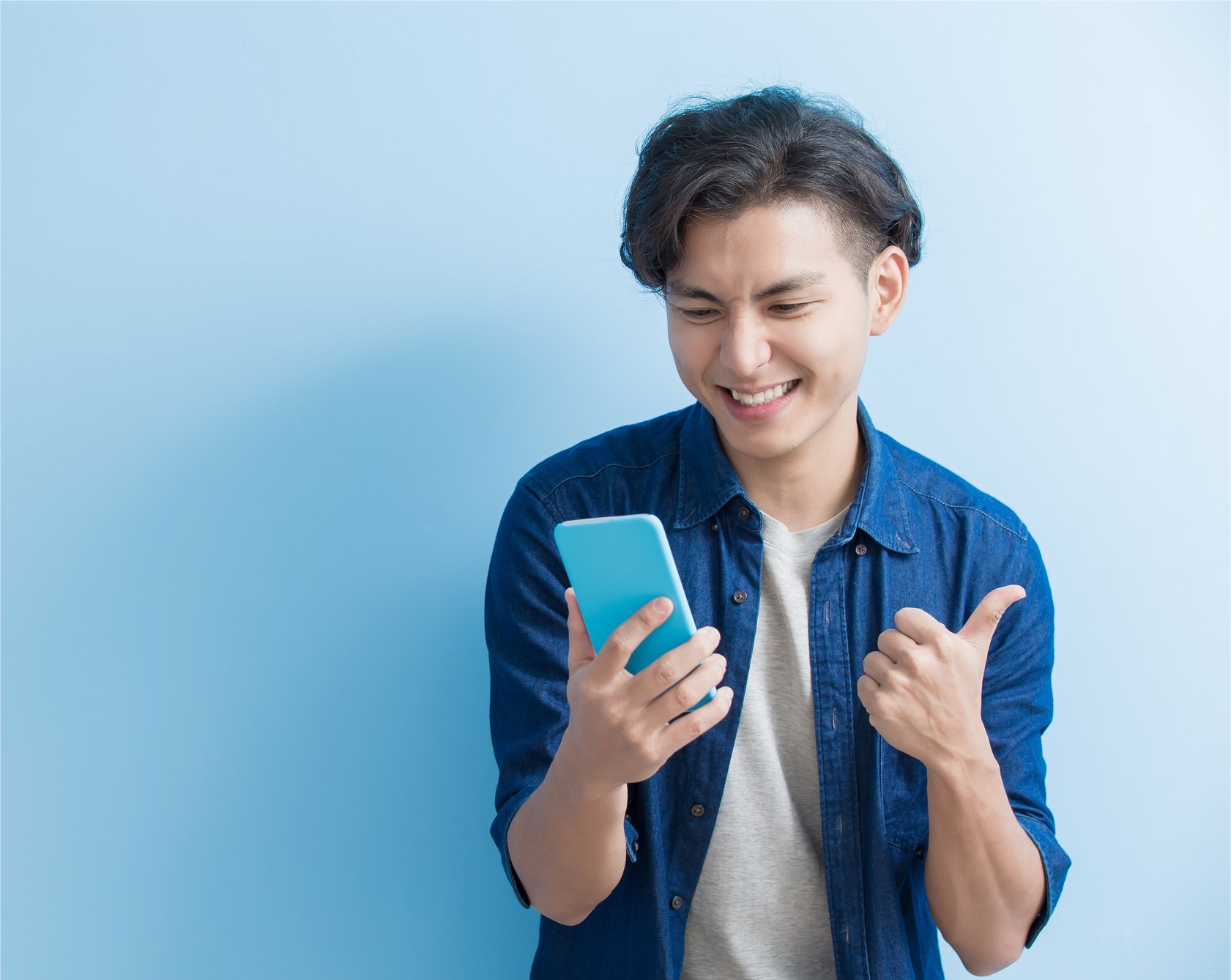 A man uses a smartphone.