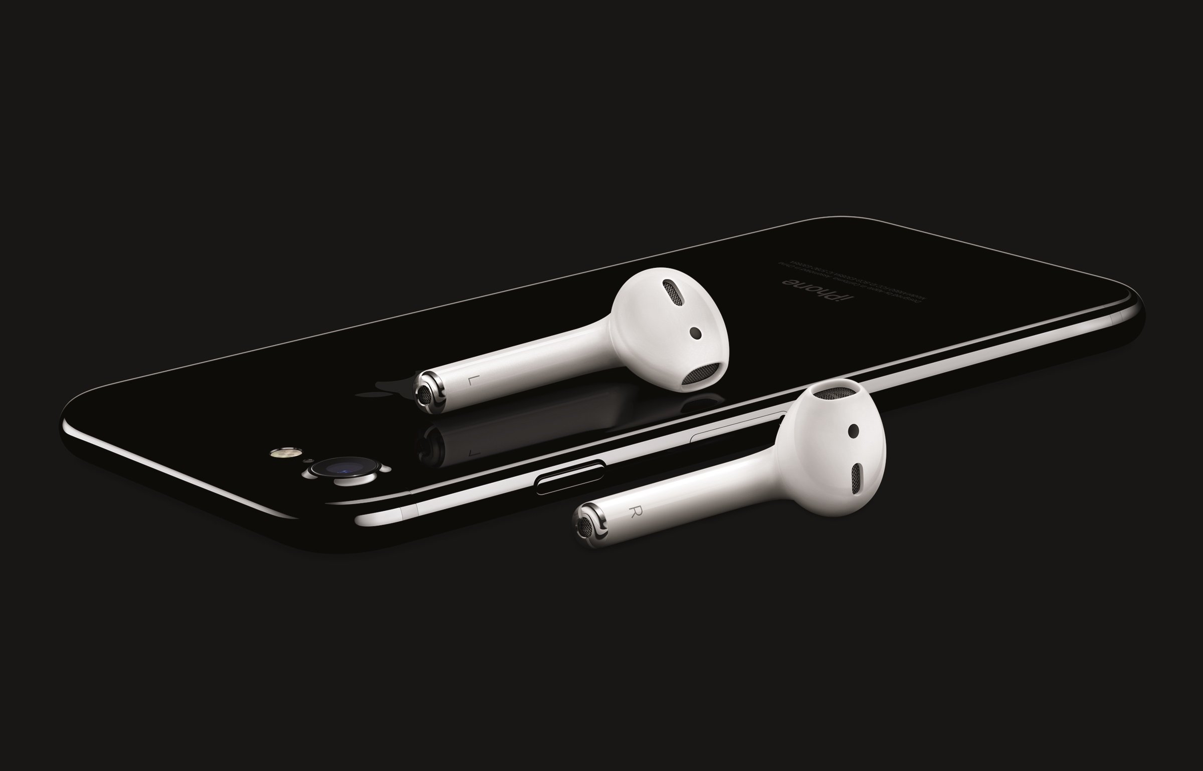 Apple's iPhone 7 in Jet Black with a pair of AirPod wireless earbuds.