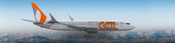 A Gol plane in the air.